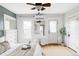Bright bedroom with hardwood floors, mini-split AC, and white-painted trim at 3005 Grove St, Denver, CO 80211