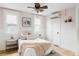 Charming bedroom with decorative wainscoting, mini-split AC, and light pink walls at 3005 Grove St, Denver, CO 80211