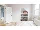 Bedroom features open door, built-in shelving niche, and a large window at 3005 Grove St, Denver, CO 80211