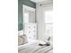 Bedroom showcasing white dresser, and modern decor, creating a serene atmosphere at 3005 Grove St, Denver, CO 80211
