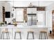 Modern kitchen boasting white cabinets, stainless steel appliances, and a spacious countertop at 3005 Grove St, Denver, CO 80211