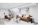 Basement living room featuring modern furniture, decor, and staircase at 3005 Grove St, Denver, CO 80211