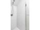 Modern tiled shower featuring a rain shower head and sleek fixtures at 3005 Grove St, Denver, CO 80211