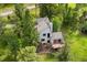 Aerial view of the home showcasing a deck and mature trees on the property at 1129 Genesee Vista Rd, Golden, CO 80401