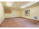 Unfinished basement with window, and cabinet offering natural light and storage at 1129 Genesee Vista Rd, Golden, CO 80401