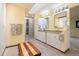 Large bathroom featuring double sinks, generous vanity space, and glass door shower at 1129 Genesee Vista Rd, Golden, CO 80401