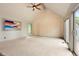 Bright bedroom with vaulted ceilings, and slider to a private deck at 1129 Genesee Vista Rd, Golden, CO 80401