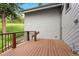 Spacious deck with wooden railing overlooks lush greenery at 1129 Genesee Vista Rd, Golden, CO 80401