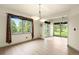 Light-filled dining room with scenic views and modern lighting at 1129 Genesee Vista Rd, Golden, CO 80401