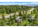 Charming home situated among lush trees with mountain views and a glimpse of a neighborhood road at 1129 Genesee Vista Rd, Golden, CO 80401