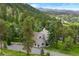Stunning exterior of a home nestled in a lush, mountainous landscape at 1129 Genesee Vista Rd, Golden, CO 80401
