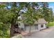 Home's exterior showcases a wooden ramp with trees surrounding the property at 1129 Genesee Vista Rd, Golden, CO 80401