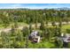 Well-maintained house surrounded by mature trees, offering a serene and private setting at 1129 Genesee Vista Rd, Golden, CO 80401