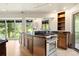 Modern kitchen featuring stainless steel appliances, black counters, and natural light at 1129 Genesee Vista Rd, Golden, CO 80401