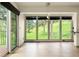 Bright living room with large windows, slider to deck, and lots of light at 1129 Genesee Vista Rd, Golden, CO 80401
