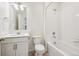 Clean, well-lit bathroom with a shower-tub combo, and a vanity with plenty of storage at 27684 E Byers Ave, Aurora, CO 80018