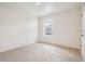 Bright bedroom with neutral carpet and white walls, offering a clean and serene space at 27684 E Byers Ave, Aurora, CO 80018