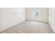 Bright carpeted bedroom featuring a window at 27684 E Byers Ave, Aurora, CO 80018