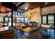 Stylish clubhouse interior with bar area, modern lighting, and comfortable seating, perfect for gatherings at 27684 E Byers Ave, Aurora, CO 80018