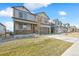 A well-maintained two-story home, with a landscaped front yard and a covered porch, perfect for suburban living at 27684 E Byers Ave, Aurora, CO 80018