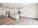 Open-concept kitchen with a large island, stainless steel appliances, and ample cabinet space at 27684 E Byers Ave, Aurora, CO 80018