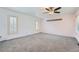 Spacious bedroom featuring neutral walls, ceiling fan, and carpeted floors at 8095 E Lehigh Ave, Denver, CO 80237