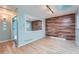 Dining room with wood floors, wood paneling and large windows for natural light at 8095 E Lehigh Ave, Denver, CO 80237