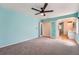 This main bedroom opens to a bathroom with a glass block window and double vanity at 8095 E Lehigh Ave, Denver, CO 80237