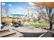Backyard deck with outdoor seating, a grill, and a green lawn at 2084 Bell Ct, Lakewood, CO 80215