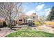 Expansive backyard with a patio and lush lawn, ideal for outdoor entertaining at 2084 Bell Ct, Lakewood, CO 80215