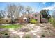 Spacious backyard with a patio, garden plots, and a detached shed, perfect for relaxation at 2084 Bell Ct, Lakewood, CO 80215