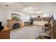 Finished basement with brick fireplace, built-in shelves, and a comfortable seating area at 2084 Bell Ct, Lakewood, CO 80215