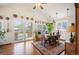 Bright dining room featuring wood floors, vaulted ceiling, and sliding doors to the patio at 2084 Bell Ct, Lakewood, CO 80215