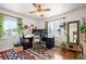 Bright home office featuring dual monitors, a ceiling fan, and an area rug at 2084 Bell Ct, Lakewood, CO 80215