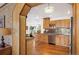 Modern kitchen view featuring stainless steel appliances, light wood cabinets, and hardwood floors at 2084 Bell Ct, Lakewood, CO 80215