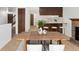 Cozy dining area featuring a fireplace, barstool seating, and an open-concept design at 2960 S Parker Ct, Aurora, CO 80014