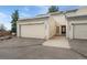 A townhouse exterior with a private single-car garage and front entrance, perfect for comfortable living at 2960 S Parker Ct, Aurora, CO 80014