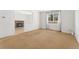 Bright living room with a cozy fireplace and large window providing natural light at 2960 S Parker Ct, Aurora, CO 80014