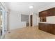 Open living room area with a breakfast bar and sliding glass doors that lead to the patio at 2960 S Parker Ct, Aurora, CO 80014