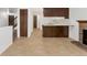 Open-concept living space with tile flooring, adjacent to kitchen and stairway at 2960 S Parker Ct, Aurora, CO 80014