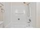 Shower featuring white tiles, a white tub and chrome fixtures at 2960 S Parker Ct, Aurora, CO 80014
