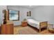 Comfortable bedroom with natural light and hardwood flooring, perfect for a restful night's sleep at 23646 Genesee Village Rd, Golden, CO 80401