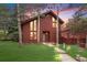 Charming two-story home with a well-manicured lawn and inviting walkway, perfect for curb appeal at 23646 Genesee Village Rd, Golden, CO 80401