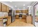 Well-lit kitchen with modern stainless-steel appliances, butcher block countertops, and ample cabinet space for storage at 23646 Genesee Village Rd, Golden, CO 80401