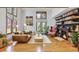 Cozy living room featuring a fireplace, built-in bookshelves, and ample natural light for a comfortable living space at 23646 Genesee Village Rd, Golden, CO 80401