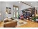 Inviting living room with vaulted ceilings, a cozy fireplace, and stylish decor, ideal for relaxation and entertainment at 23646 Genesee Village Rd, Golden, CO 80401