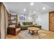 Inviting living room with cozy seating, built-in shelving, and warm lighting, perfect for relaxation at 23646 Genesee Village Rd, Golden, CO 80401