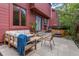 Relaxing outdoor patio featuring a hot tub and comfortable seating area at 23646 Genesee Village Rd, Golden, CO 80401