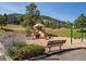Community playground with slide and swing set, perfect for Gathering fun at 23646 Genesee Village Rd, Golden, CO 80401