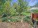 Lush backyard garden space filled with an array of plants, trees, and greenery at 9236 W Euclid Ave, Littleton, CO 80123